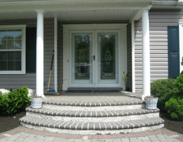 Entryway leading up to storm doors