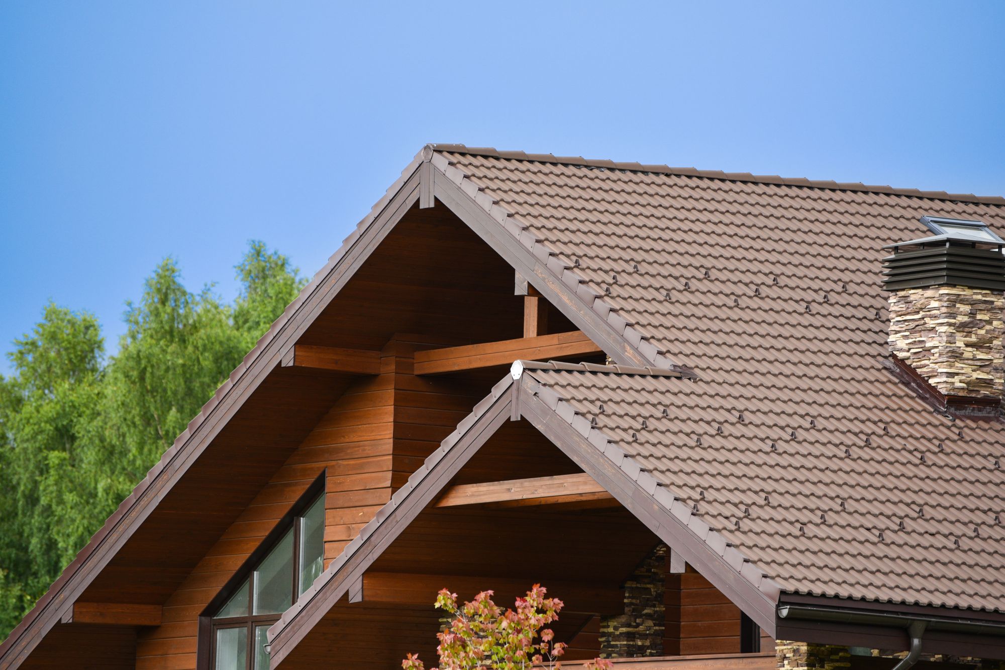 A brown new roof on a bright summer day