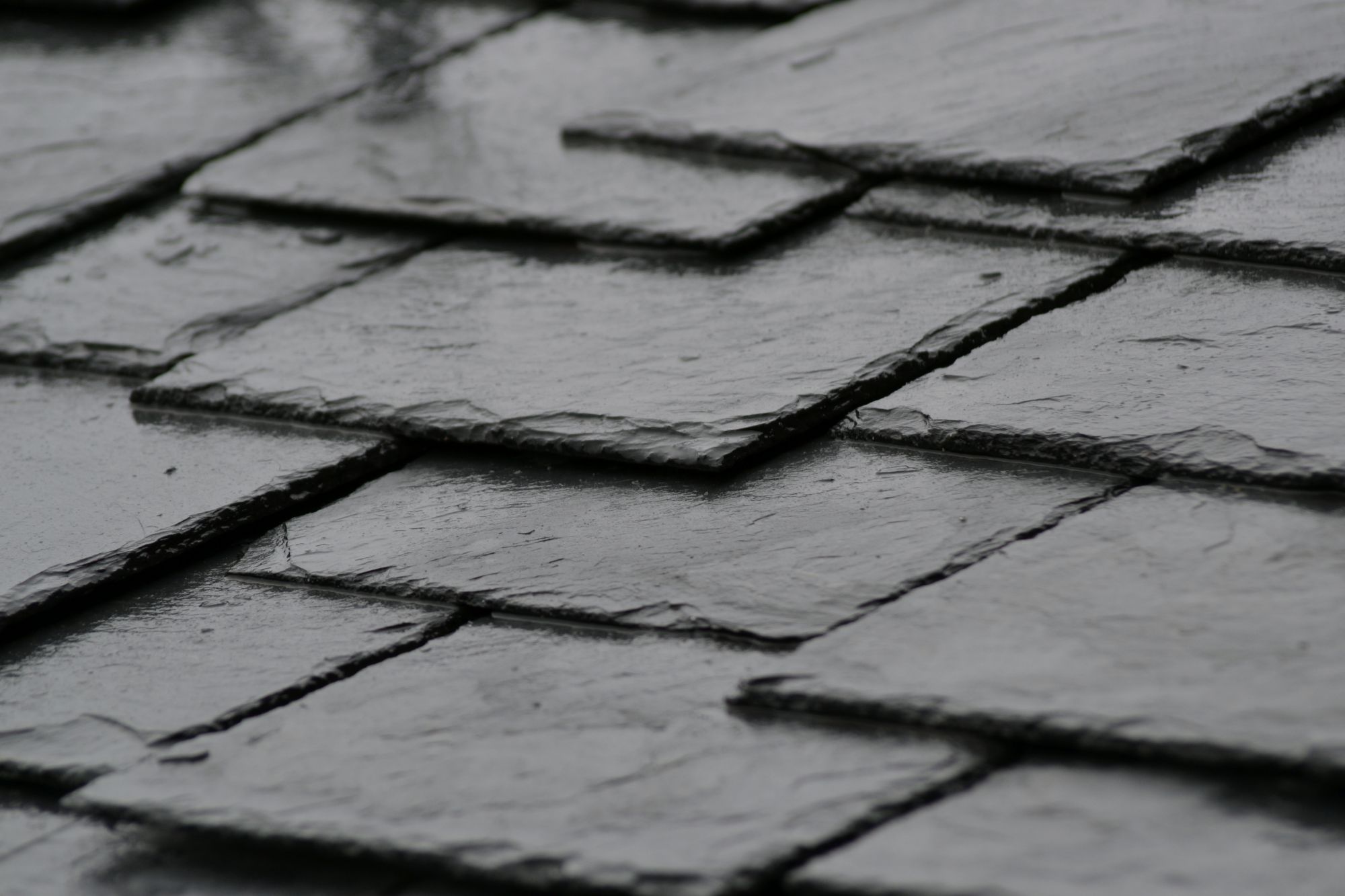 Grey Slate Roofing Tiles On A Home