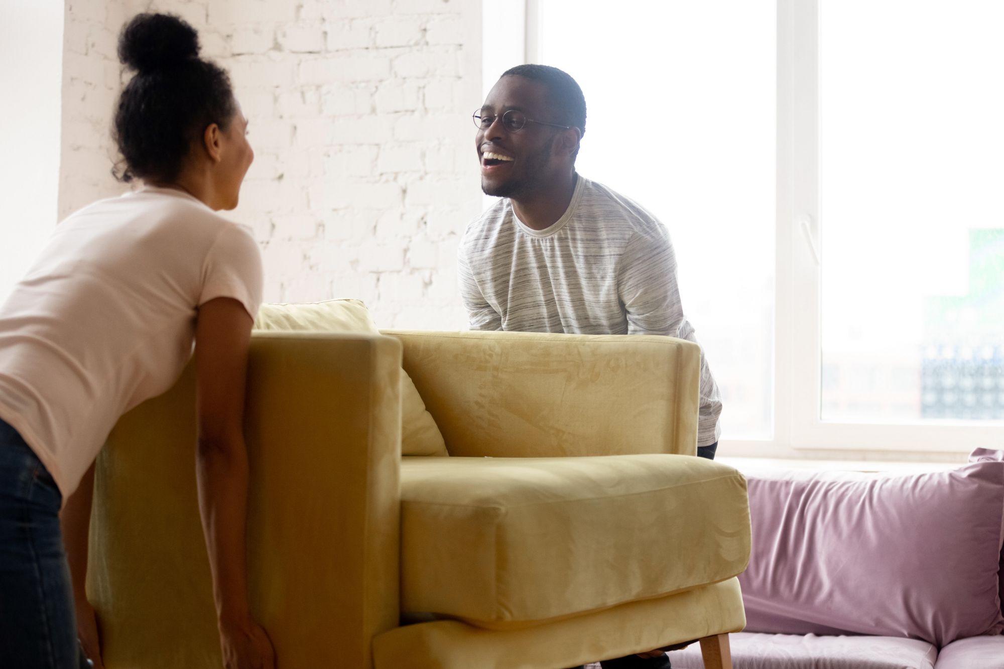 Couple moving furniture