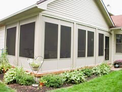 Tan patio enclosure installed by Fairview Home Improvement in Cleveland, Ohio area