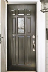 Glossy black front door installation by Fairview Home Improvement in Cleveland, Ohio area