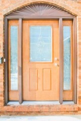 Light brown front door installation by Fairview Home Improvement in Cleveland, Ohio area
