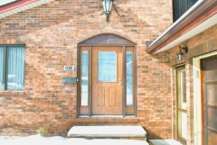 Brown front door installation by Fairview Home Improvement in Cleveland, Ohio area