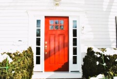 Red front door installation by Fairview Home Improvement in Cleveland, Ohio area