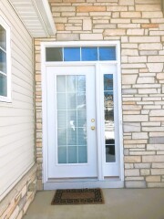 White storm door & dark brown front door installation by Fairview Home Improvement in Cleveland, Ohio area