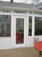 White patio enclosure installed by Fairview Home Improvement in Cleveland, Ohio area