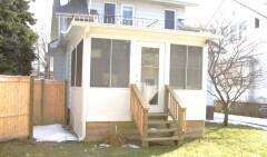 White patio enclosure installed by Fairview Home Improvement in Cleveland, Ohio area