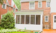 White patio enclosure installed by Fairview Home Improvement in Cleveland, Ohio area