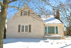 Multiple single hung replacement windows and bow window installed by Fairview Home Improvement in Cleveland, Ohio area