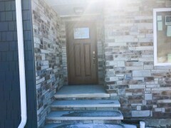 White storm door & dark brown front door installation by Fairview Home Improvement in Cleveland, Ohio area
