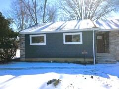 Navy blue siding installed by Fairview Home Improvement in Fairview Park, Ohio